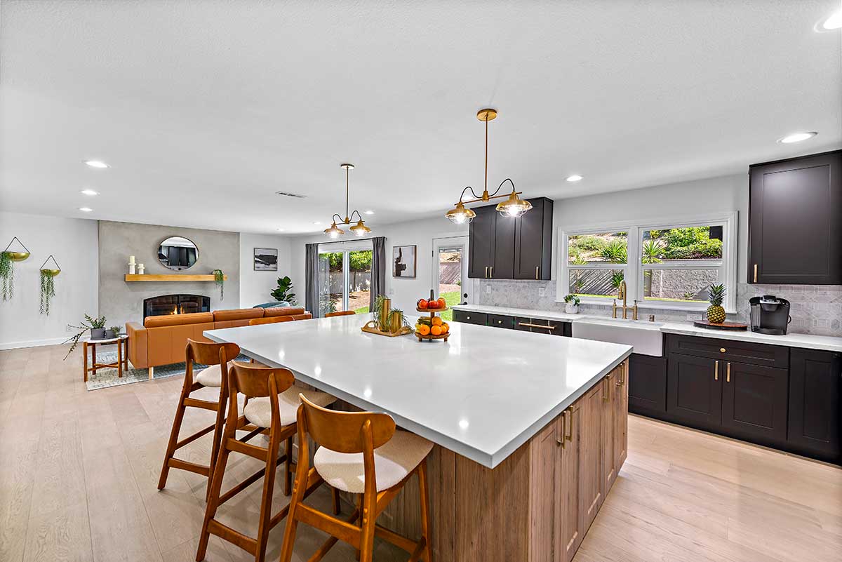 capo beach treatment center kitchen with island and chairs