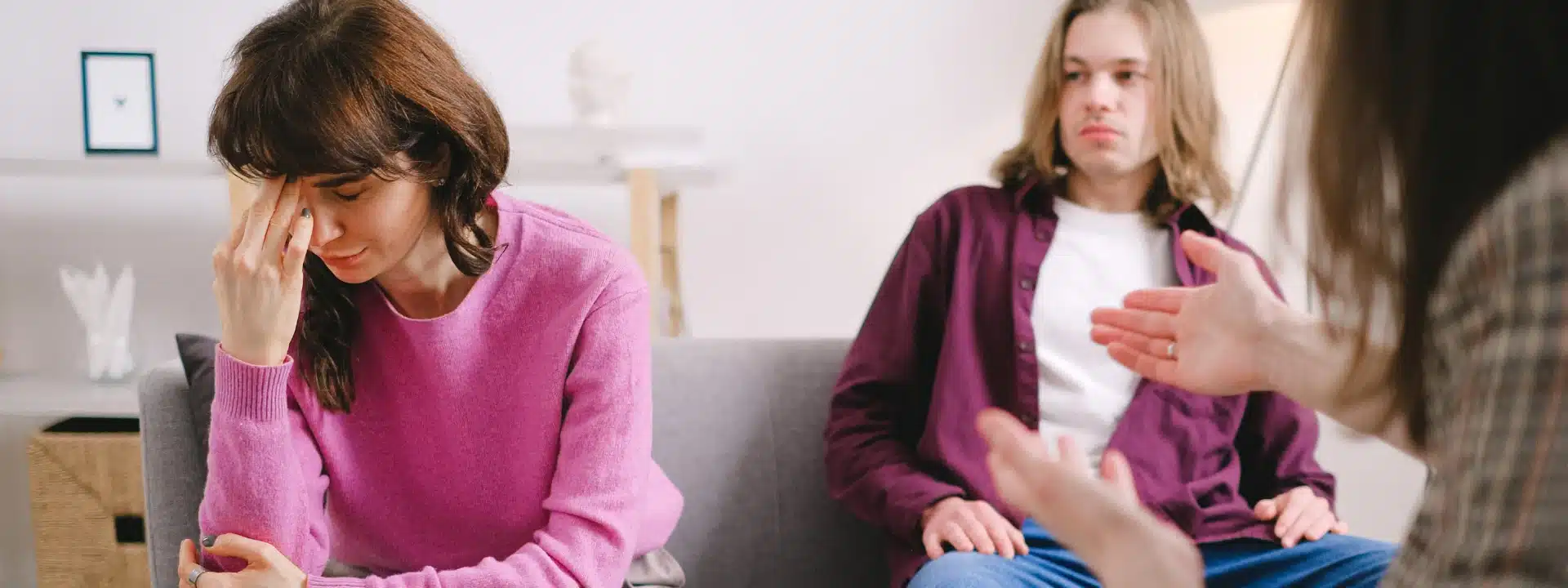 Stressed couple during therapy session – exploring the connection between chronic stress and depression for better mental health awareness and support.