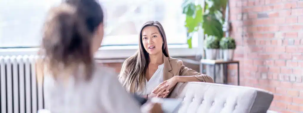 Calm woman speaking with therapist during a counseling session – professional mental health support at Alter Behavioral Health.