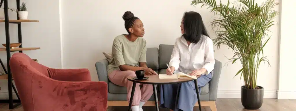 Therapist and patient in calm discussion during a mental health session—highlighting compassionate support and treatment for bipolar depression in a professional setting.