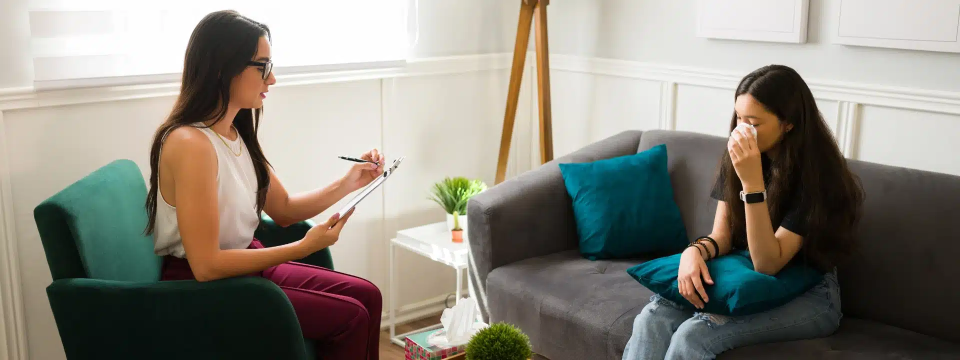 female therapist talking with woman during counseling session about insurance coverage for residential trauma care at Alter Behavioral Health for Women