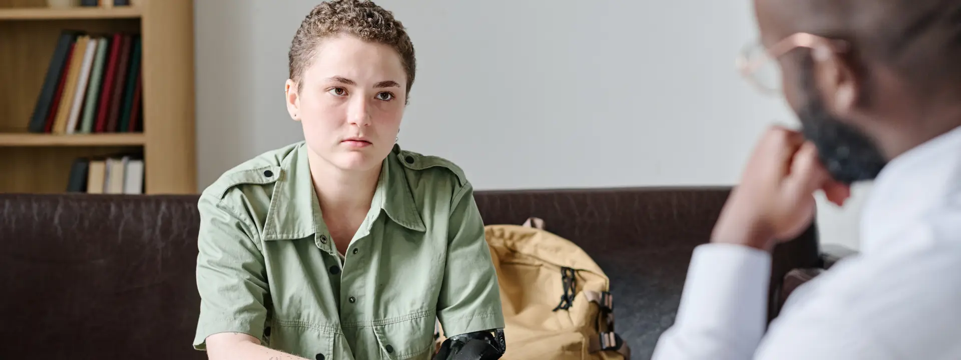 Therapist supporting a patient in processing and healing from a traumatic experience