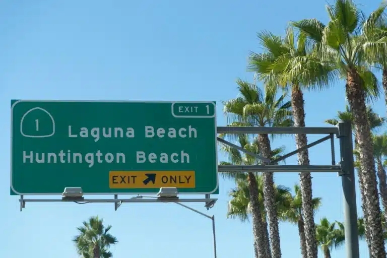 Laguna Woods community entrance sign surrounded by greenery and landscaped area