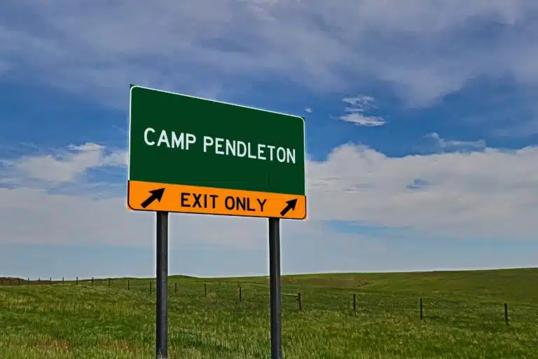 A green sign featuring a black border, indicating a specific location or information.