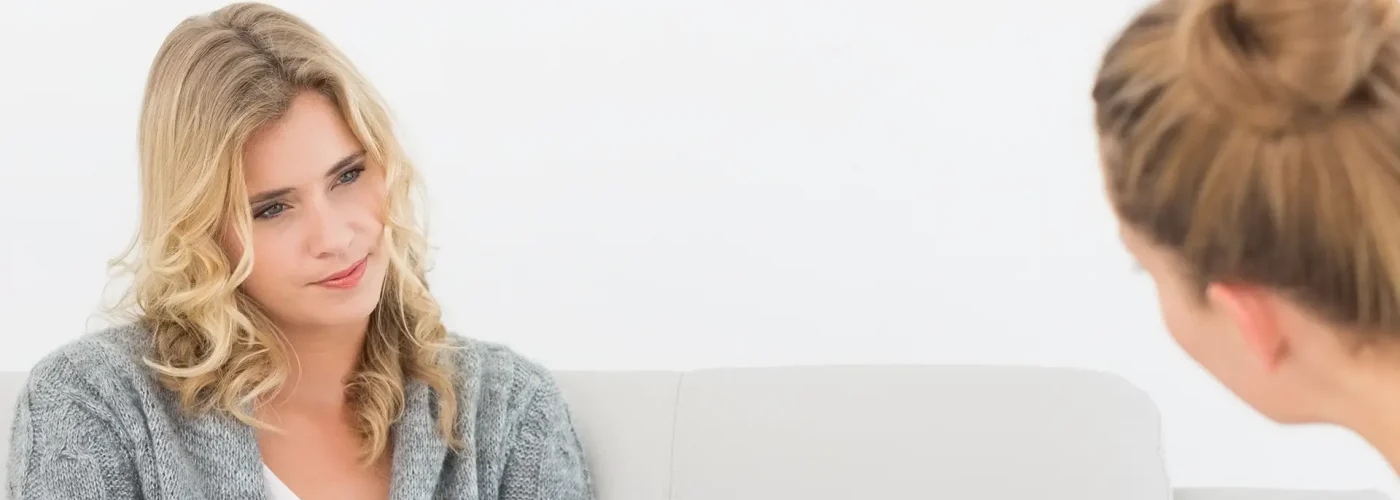 Therapist reviewing diagnostic tests and patient history in a residential mental health facility