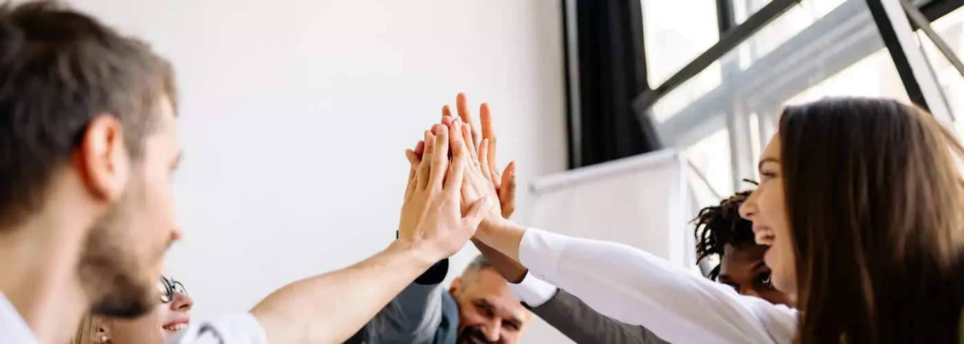 Psychiatrist, therapist, and case manager welcoming a patient on their first day of treatment